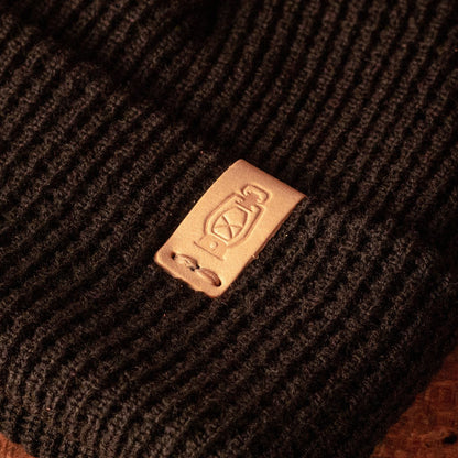 Leather logo detail on the Waffle Knit Watch Cap by Dark Forest