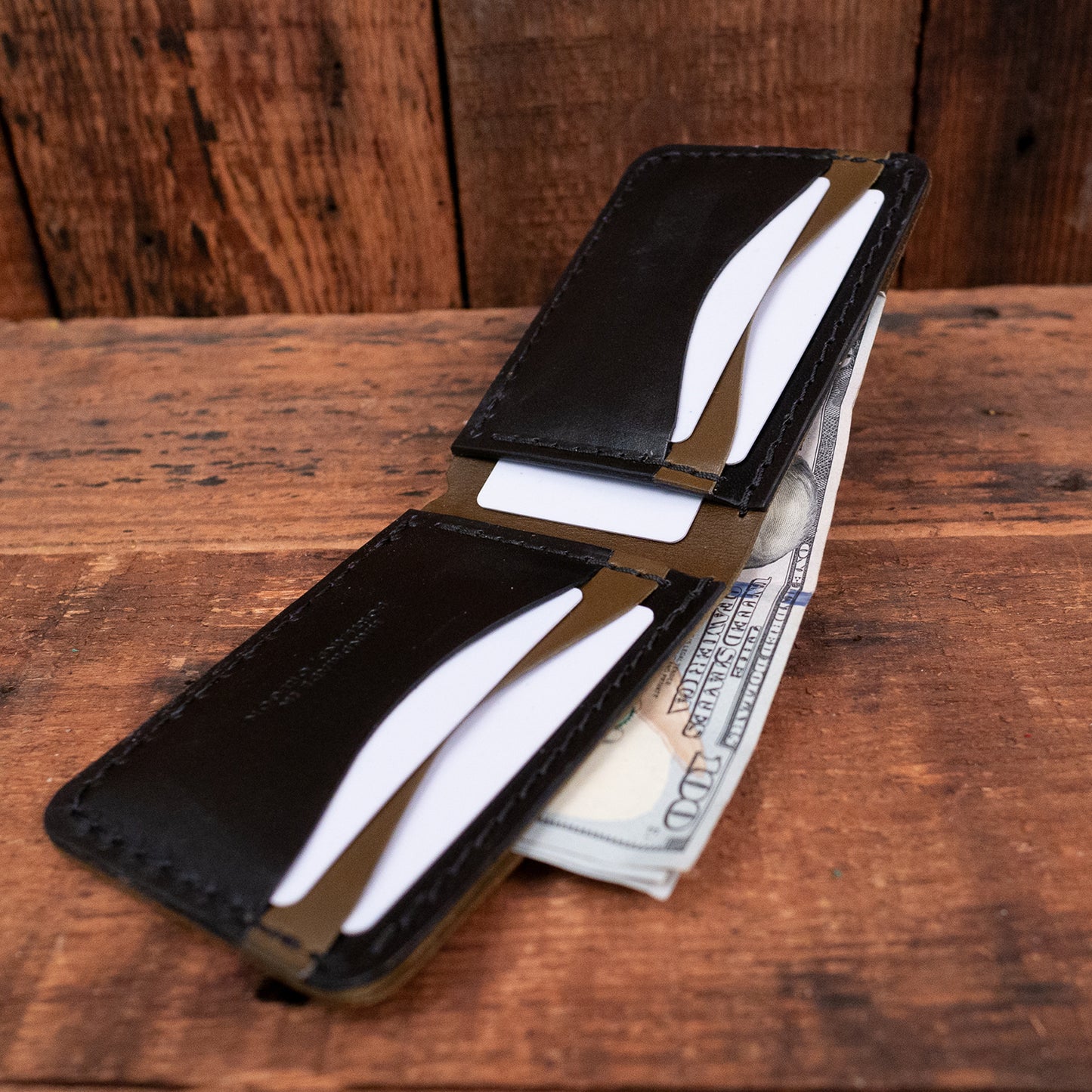 Detail of the Wrangler Two Tone Wallet in Olive / Black Leather by Dark Forest