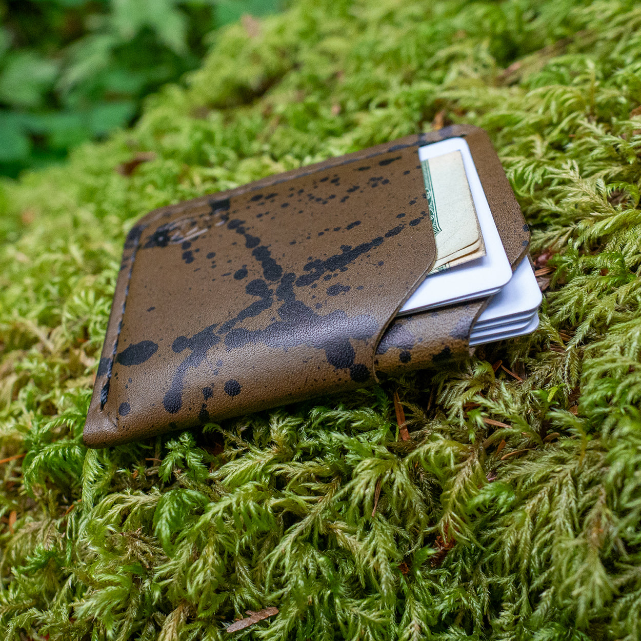 Detail of the Rustler Splatter Wallet in Chocolate Splatter Leather by Dark Forest