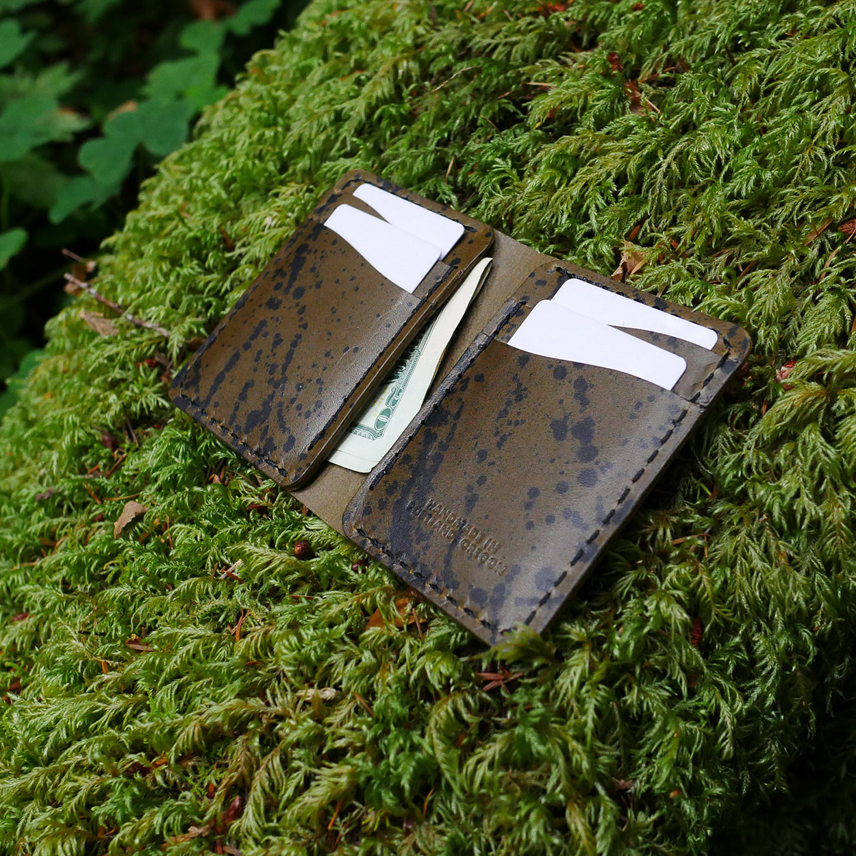 Detail of the Rangeland Splatter Wallet in Olive Splatter by Dark Forest